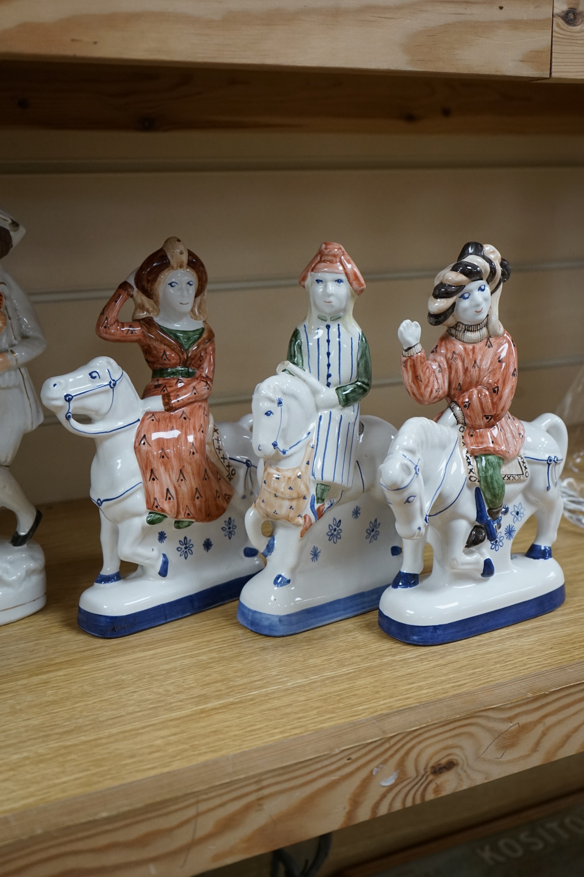 Three Rye pottery figures on horseback and to Staffordshire figures including Uncle Tom, tallest 30cm. Condition - fair to good